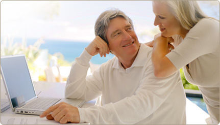 Mature couple using a laptop